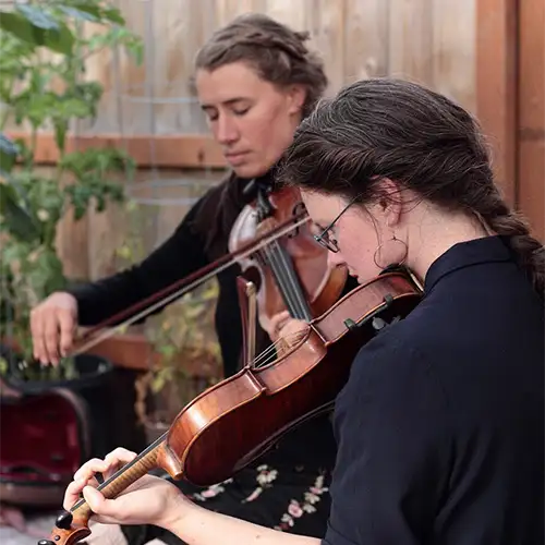 Channing and Annie playing fiddle
